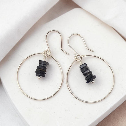 Bijou by SAM handmade sterling silver hoop earrings featuring a delicate stack of deep blue square-cut iolite gemstones.