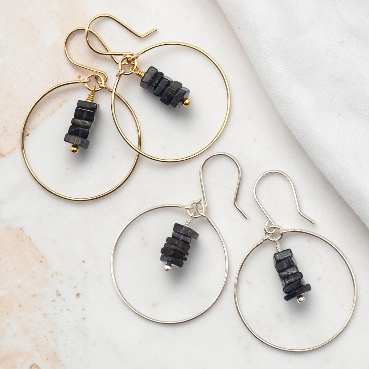 Bijou by SAM handmade hoop earrings featuring square-cut deep blue iolite gemstones in gold fill and sterling silver.