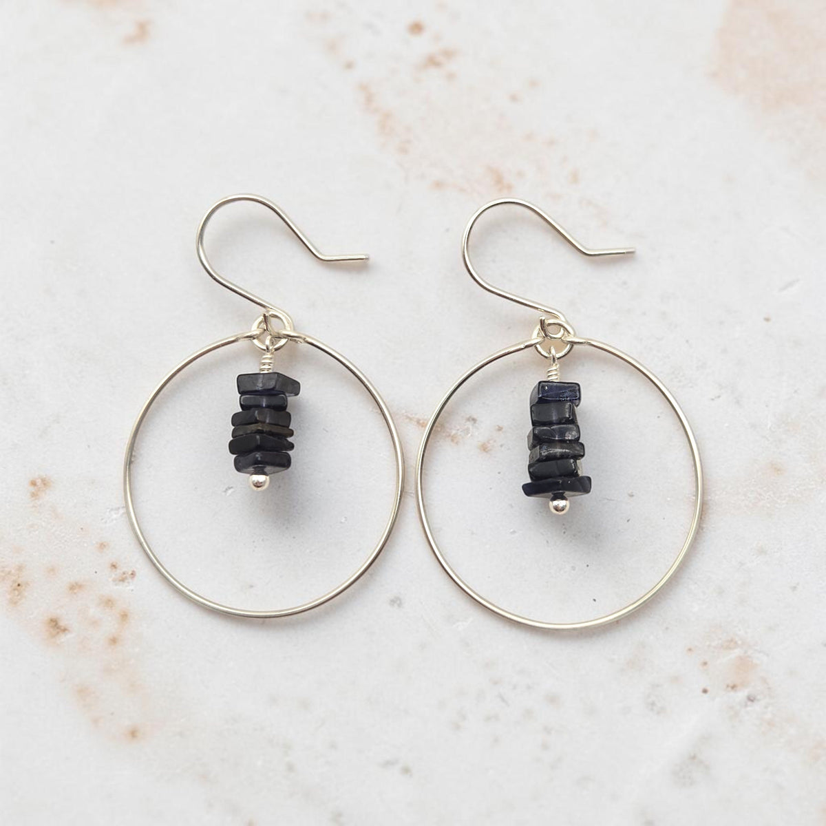 Bijou by SAM handmade hoop earrings featuring a delicate stack of deep blue square-cut iolite gemstones on silver