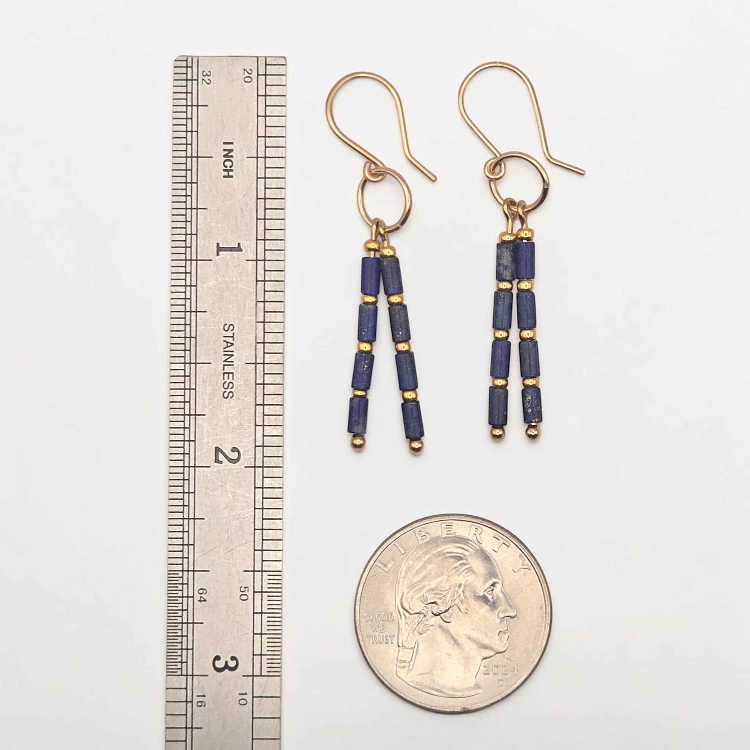 Bijou by SAM Midnight Sky earrings featuring deep blue Lapis Lazuli tube beads and gold spacers on gold hoops.