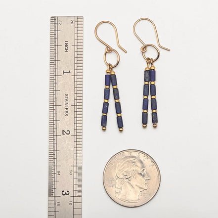 Bijou by SAM Midnight Sky earrings featuring deep blue Lapis Lazuli tube beads and gold spacers on gold hoops.