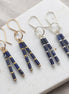 Bijou by SAM Midnight Sky earrings featuring natural Lapis Lazuli tube beads with gold and silver metal accents.