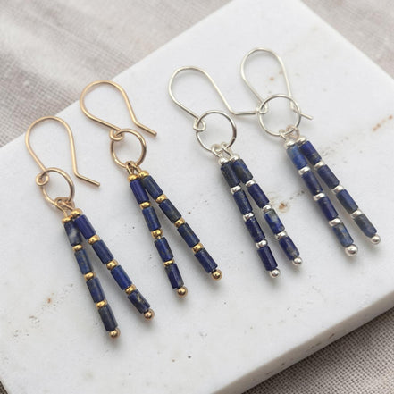 Bijou by SAM Midnight Sky earrings featuring natural Lapis Lazuli tube beads with gold and silver metal accents.