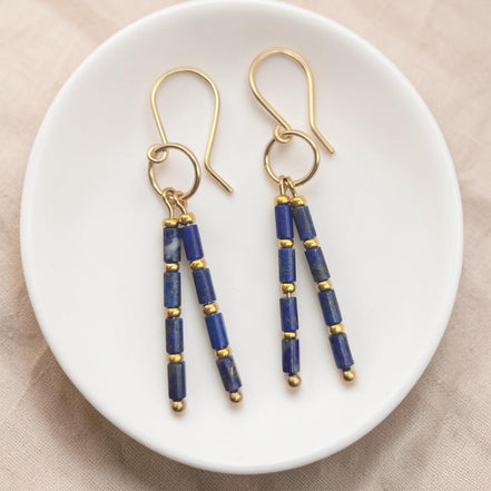 Bijou by SAM Midnight Sky earrings featuring deep blue Lapis Lazuli tube beads and 14k gold fill accents on hoops.