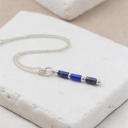 Bijou by SAM Midnight Sky necklace featuring natural lapis lazuli tube beads on a delicate sterling silver chain.