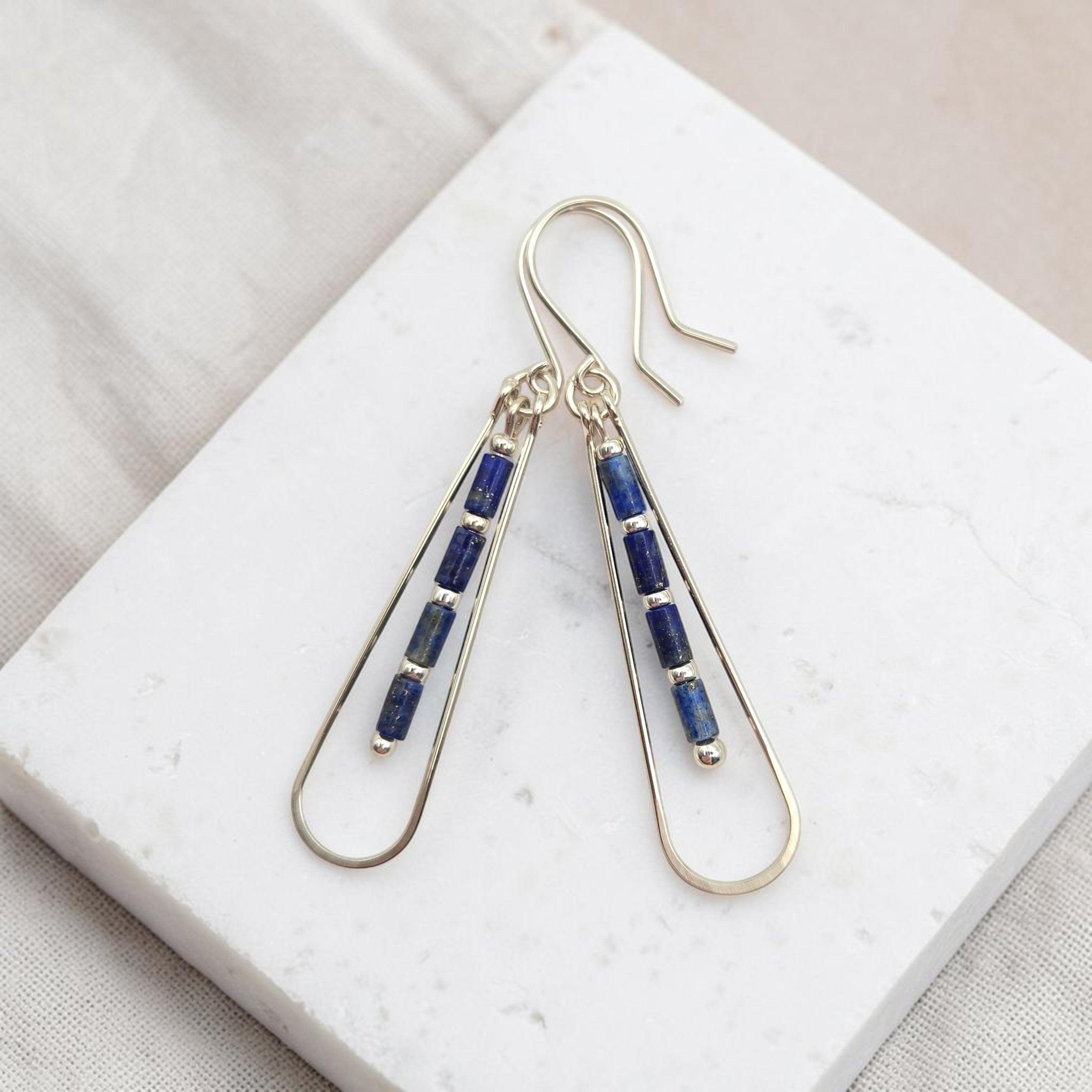 Bijou by SAM Midnight Sky teardrop earrings featuring natural blue Lapis Lazuli tube beads on silver hoops.