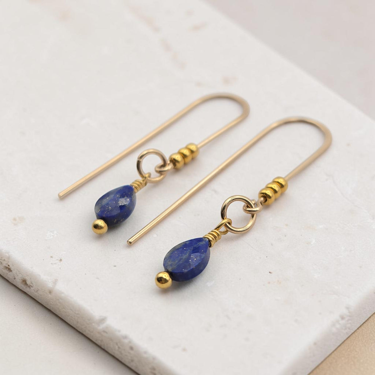 Bijou by SAM handcrafted 14k gold fill threader earrings featuring teardrop-shaped genuine Lapis Lazuli gemstones.
