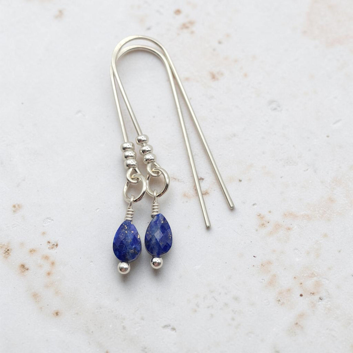 Bijou by SAM handcrafted sterling silver threader earrings featuring faceted teardrop Lapis Lazuli gemstones.