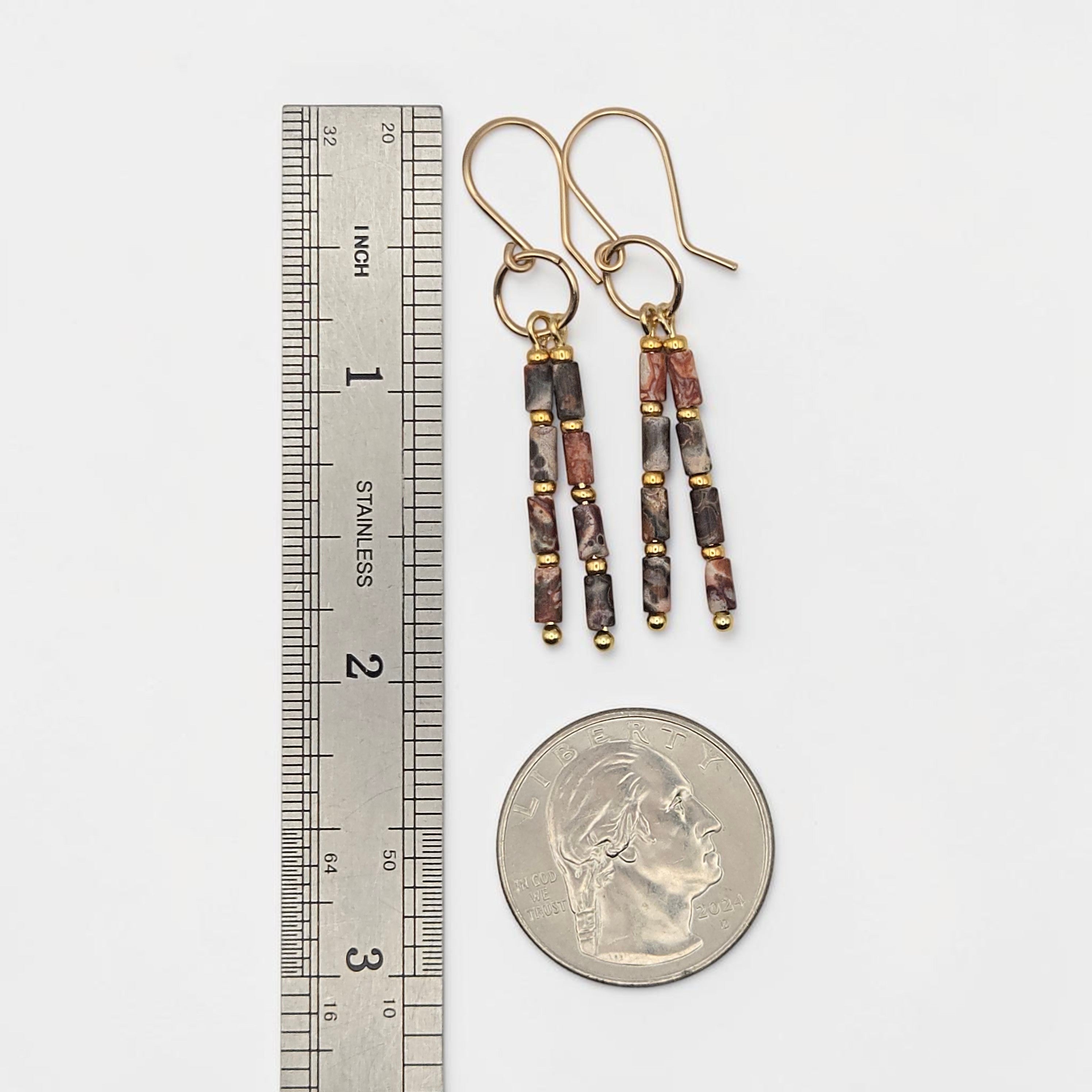 Bijou by SAM Wild Mesa earrings featuring leopard skin jasper tube beads and 14k gold fill hoops on a white background.