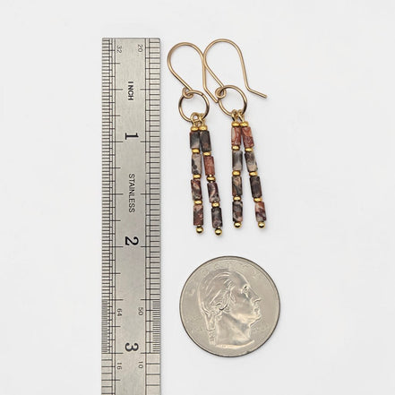 Bijou by SAM Wild Mesa earrings featuring leopard skin jasper tube beads and 14k gold fill hoops on a white background.