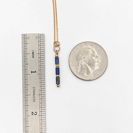 Bijou by SAM Midnight Sky Necklace featuring natural blue Lapis Lazuli tube beads on a 14k gold fill chain with scale