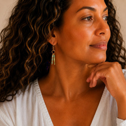 Bijou by SAM Morning Dew earrings featuring green Chrysoprase tube beads and gold hoops worn by a woman.