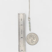 Bijou by SAM Mossy Creek necklace with green aventurine tube beads and sterling silver chain next to a ruler and coin.