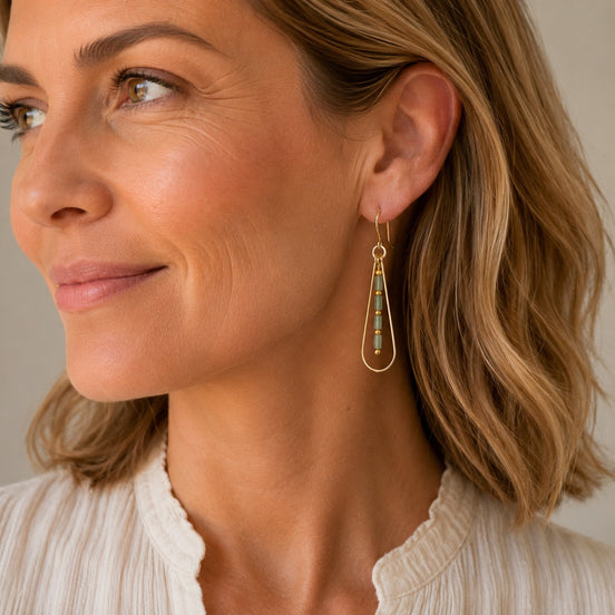 Bijou by SAM Mossy Creek teardrop earrings featuring green aventurine beads on 14k gold fill hoops worn by a woman.