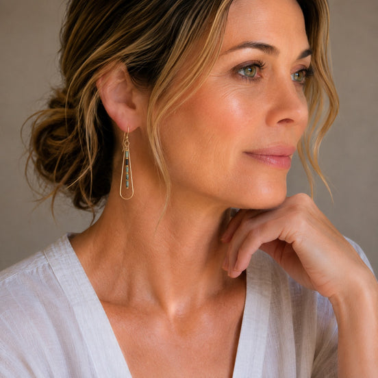 Bijou by SAM Mother Earth teardrop earrings with African Turquoise beads and 14k gold fill worn by a woman.