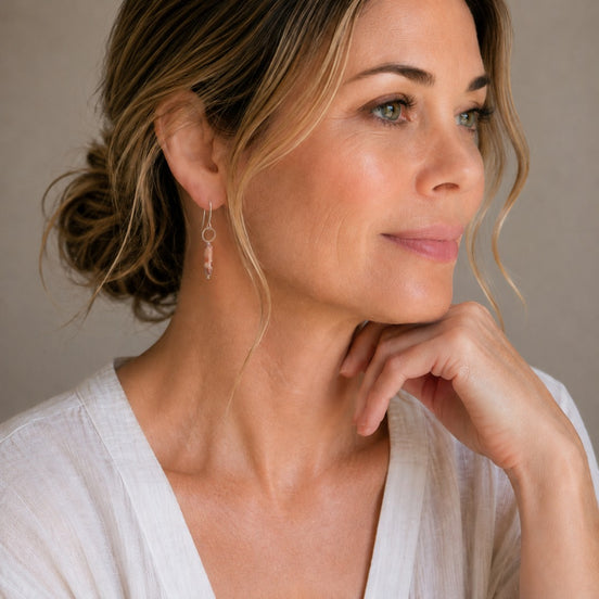 Bijou by SAM Olivia earrings featuring a Redline Jasper cylinder on a sterling silver hoop worn by a woman.