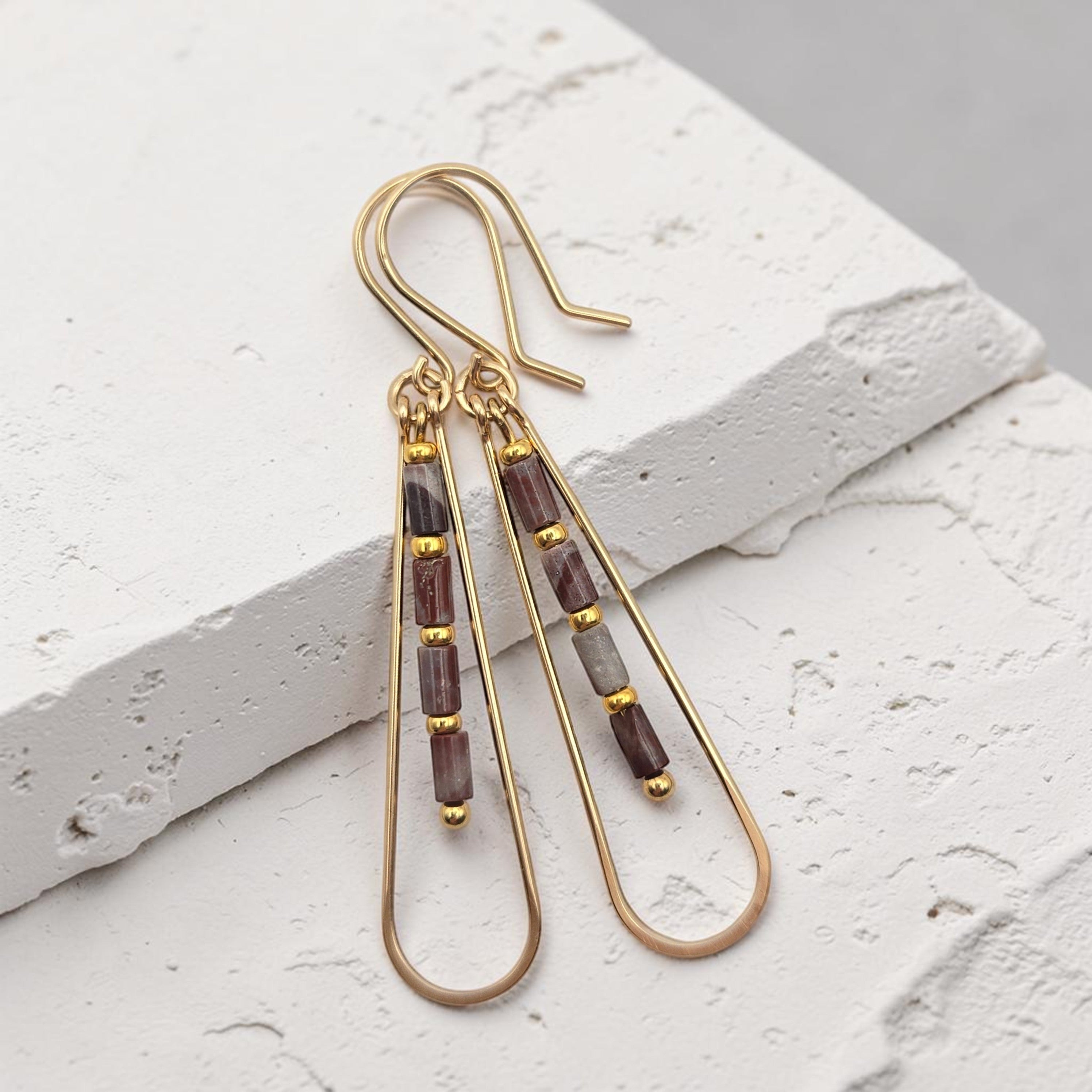 Bijou by SAM Painted Bluff teardrop hoop earrings with maroon and gray Red Rainbow Jasper beads in 14k gold fill.