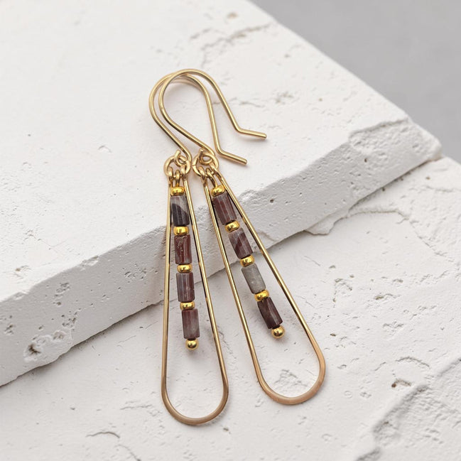 Bijou by SAM Painted Bluff teardrop hoop earrings with maroon and gray Red Rainbow Jasper beads in 14k gold fill.