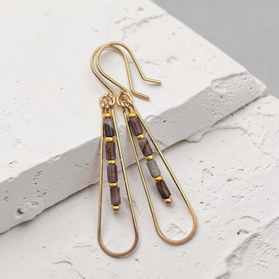 Bijou by SAM Painted Bluff teardrop hoop earrings with maroon and gray Red Rainbow Jasper beads in 14k gold fill.