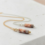 Bijou by SAM Olivia necklace featuring a cylindrical Redline Jasper bead on delicate gold fill and sterling silver chains