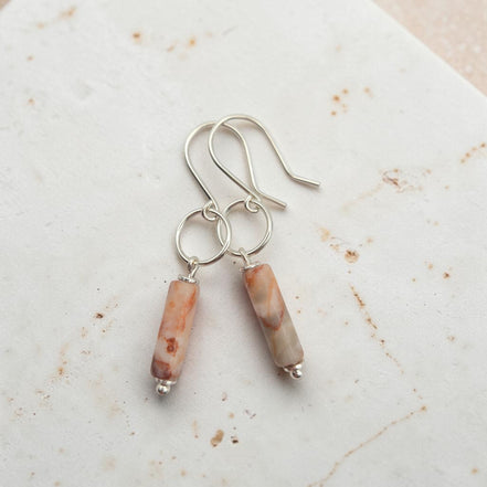 Bijou by SAM Olivia earrings featuring cylindrical Redline Jasper stones on handcrafted sterling silver hoops.