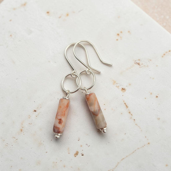 Bijou by SAM Olivia earrings featuring cylindrical Redline Jasper stones on handcrafted sterling silver hoops.
