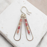 Bijou by SAM Rose Bluff teardrop hoop earrings featuring pink Rhodonite tube beads on sterling silver wire.