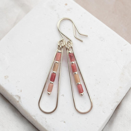 Bijou by SAM Rose Bluff teardrop hoop earrings featuring pink Rhodonite tube beads on sterling silver wire.