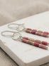 Bijou by SAM Rose Bluff dangle earrings featuring pink rhodonite tube beads and sterling silver handmade hoops.