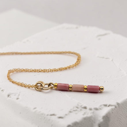 Bijou by SAM Rose Bluff necklace featuring natural pink rhodonite tube beads on a delicate 14k gold fill chain.