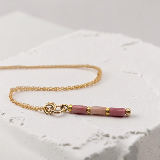 Bijou by SAM Rose Bluff necklace featuring natural pink rhodonite tube beads on a delicate 14k gold fill chain.
