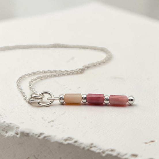 Bijou by SAM Rose Bluff necklace featuring natural pink rhodonite tube beads on a delicate sterling silver chain.