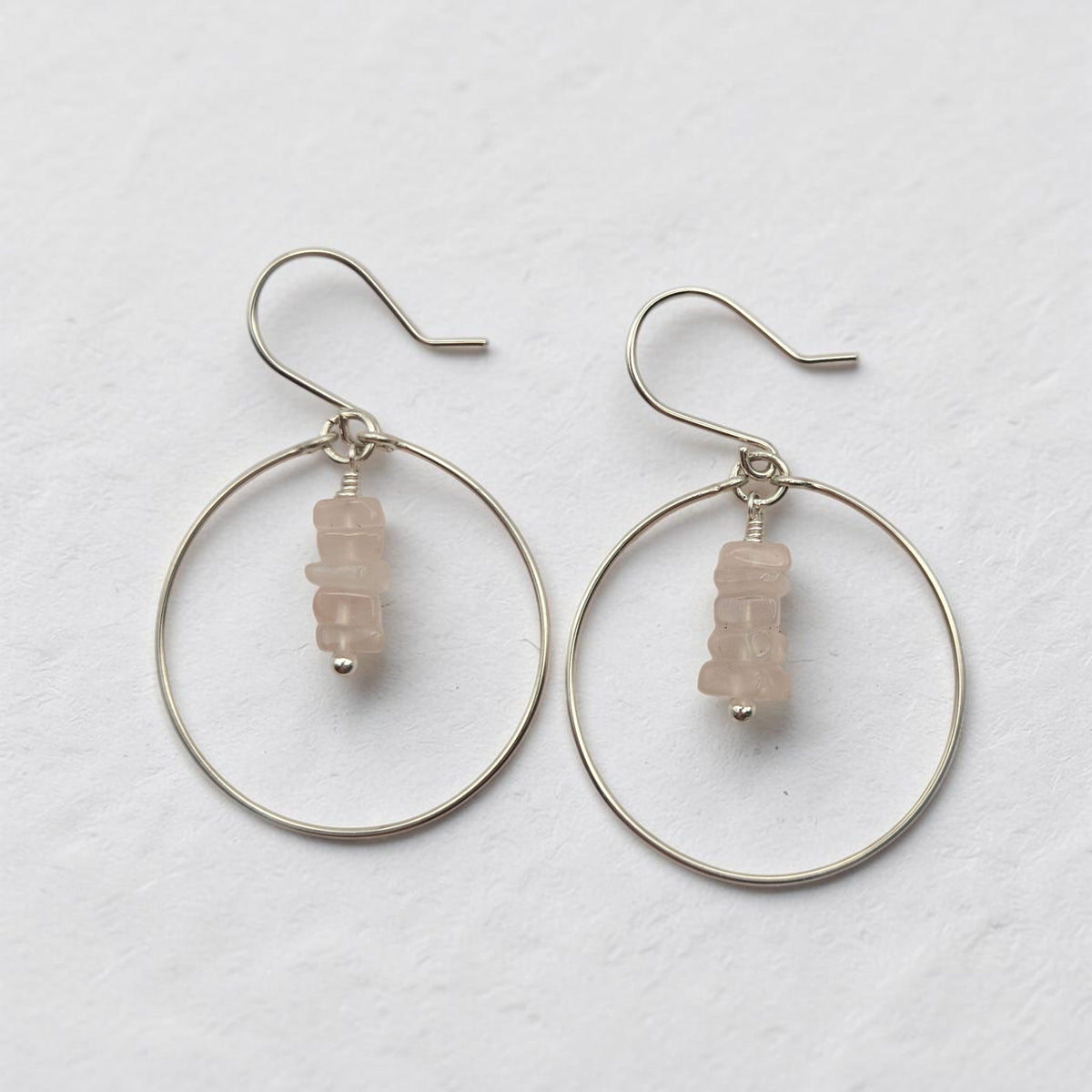 Bijou by SAM handmade sterling silver hoop earrings featuring a delicate stack of pale pink square-cut Rose Quartz.
