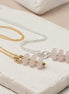 Bijou by SAM Aurora necklaces featuring soft blush rose quartz beads on delicate gold fill and sterling silver chains.