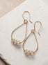 Bijou by SAM Aurora teardrop hoop earrings featuring blush rose quartz beads on 14k gold fill wire.