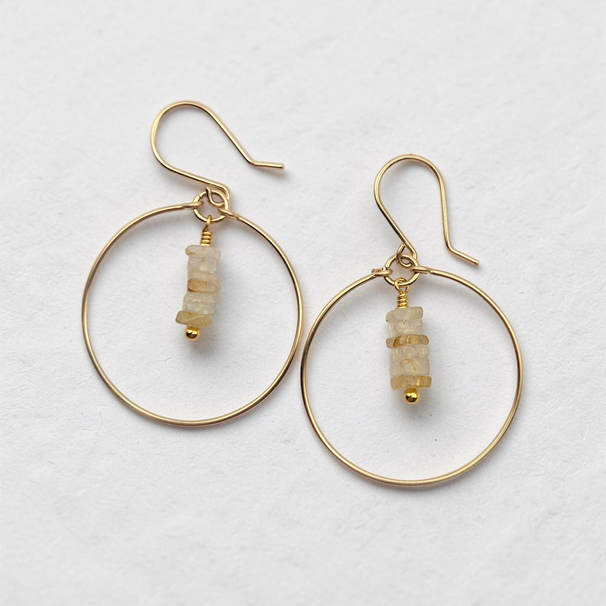 Bijou by SAM handmade gold hoop earrings featuring a delicate stack of square-cut pale yellow rutilated quartz stones.