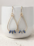 Bijou by SAM Milky Way teardrop hoop earrings featuring deep blue sodalite beads on 14k gold fill wire.
