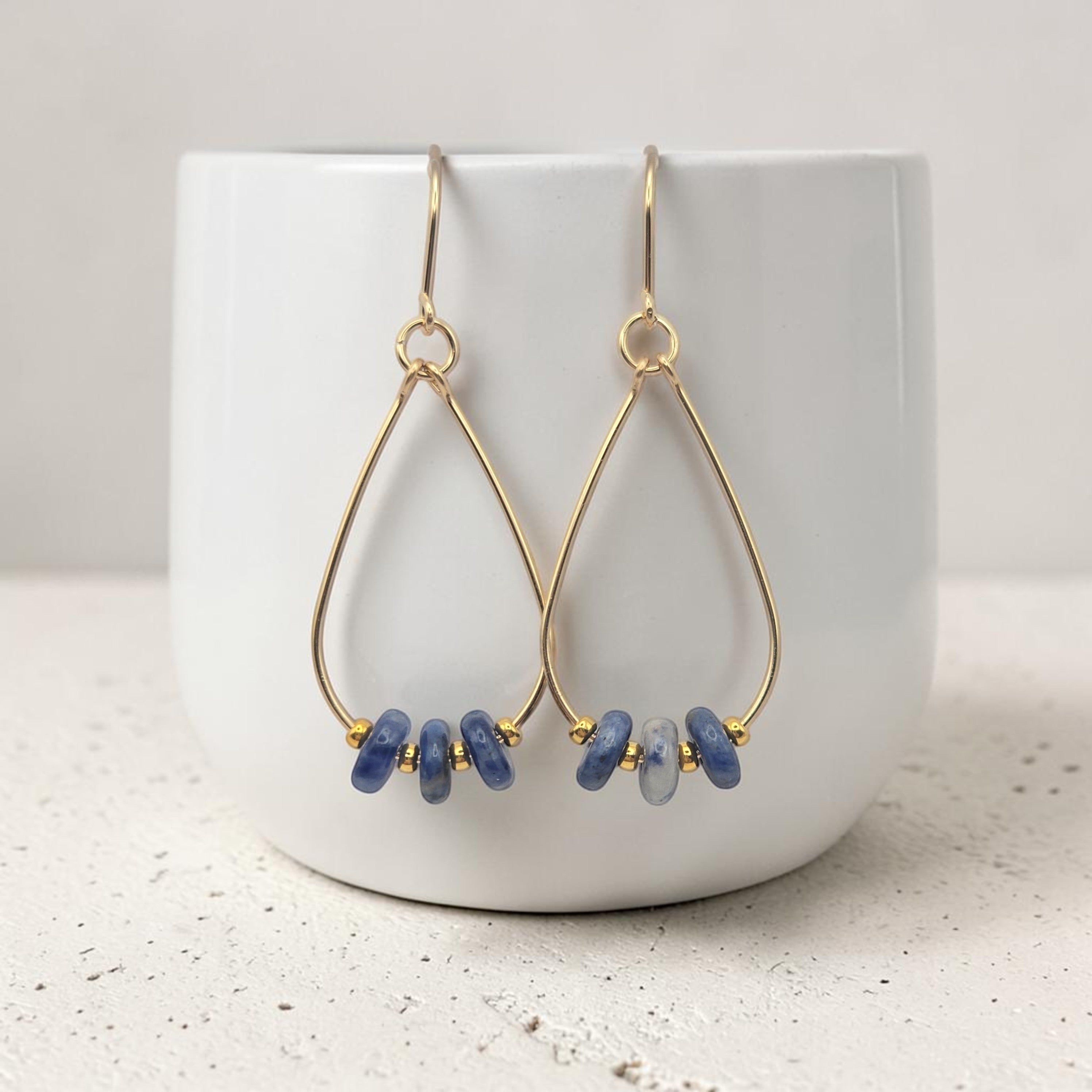 Bijou by SAM Milky Way teardrop hoop earrings featuring deep blue sodalite beads on 14k gold fill wire.