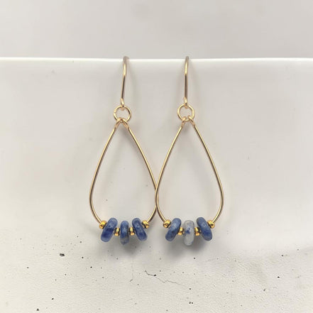 Bijou by SAM Milky Way teardrop hoop earrings featuring blue sodalite stones and 14k gold fill wire.