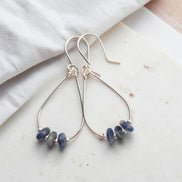 Bijou by SAM Milky Way teardrop hoop earrings featuring deep blue sodalite stones on sterling silver wire.