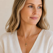 Bijou by SAM Stardust necklace featuring three stacked crazy lace agate stones on a delicate gold chain worn by model