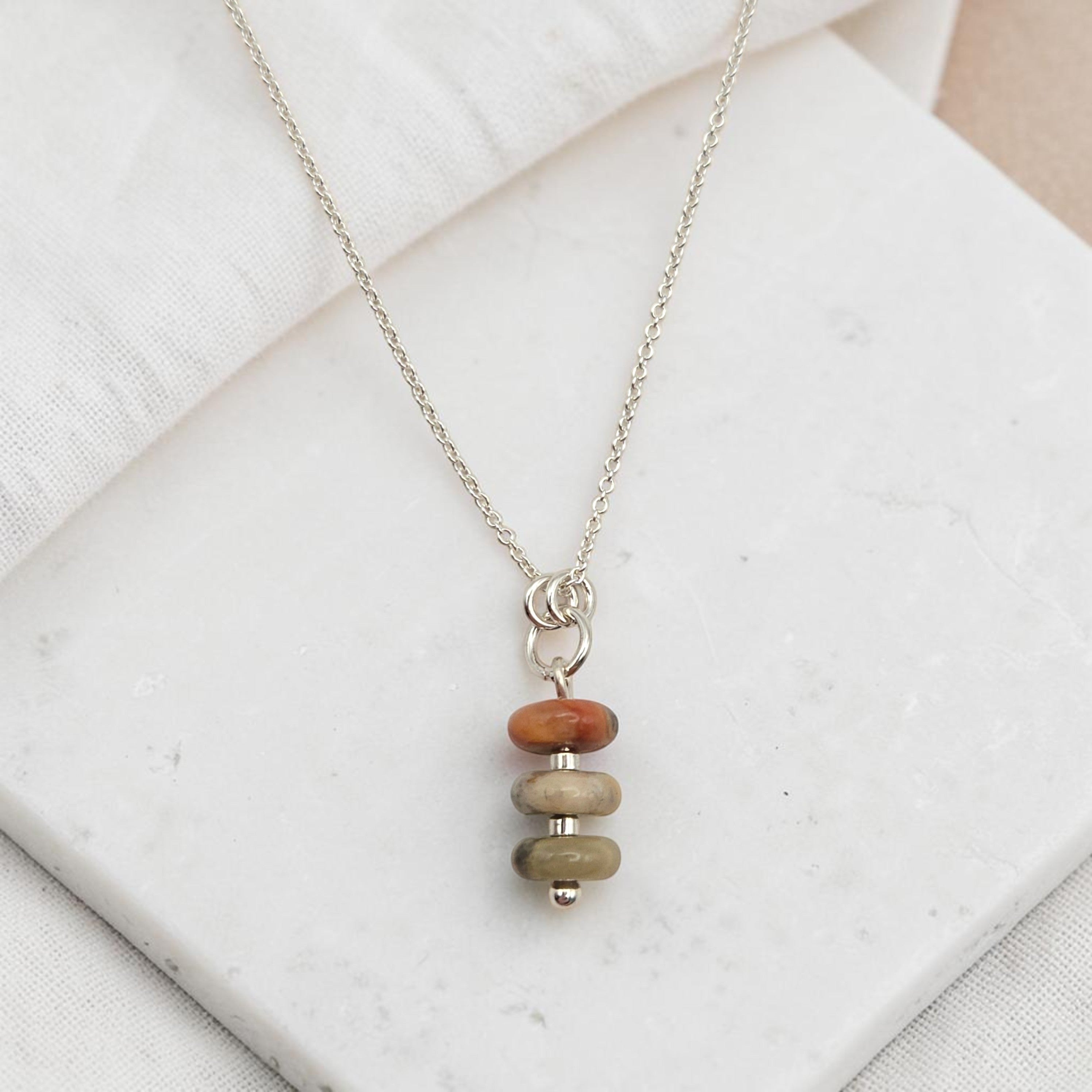 Bijou by SAM Stardust necklace featuring three stacked crazy lace agate stones in cream and coral on a silver chain.
