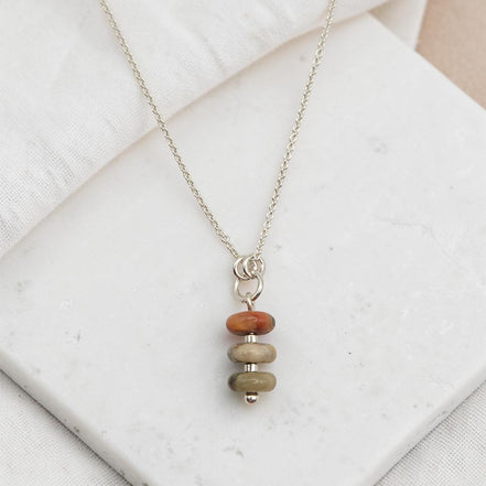 Bijou by SAM Stardust necklace featuring three stacked crazy lace agate stones in cream and coral on a silver chain.