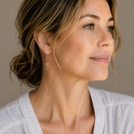 Bijou by SAM Stardust threader earrings featuring cream, coral, and tan crazy lace agate beads on a woman