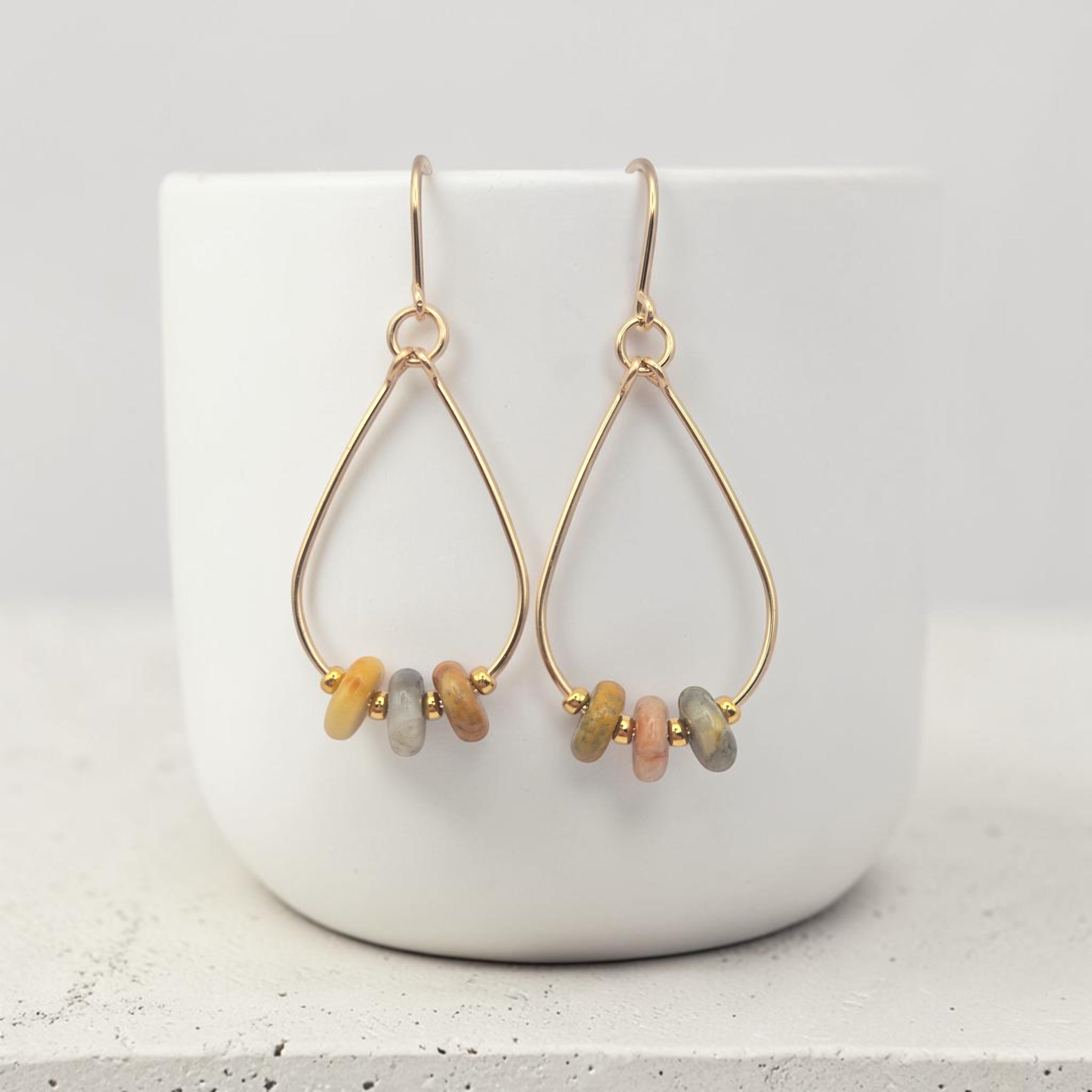 Bijou by SAM Stardust teardrop hoop earrings featuring crazy lace agate beads in cream, coral, and tan on gold fill.