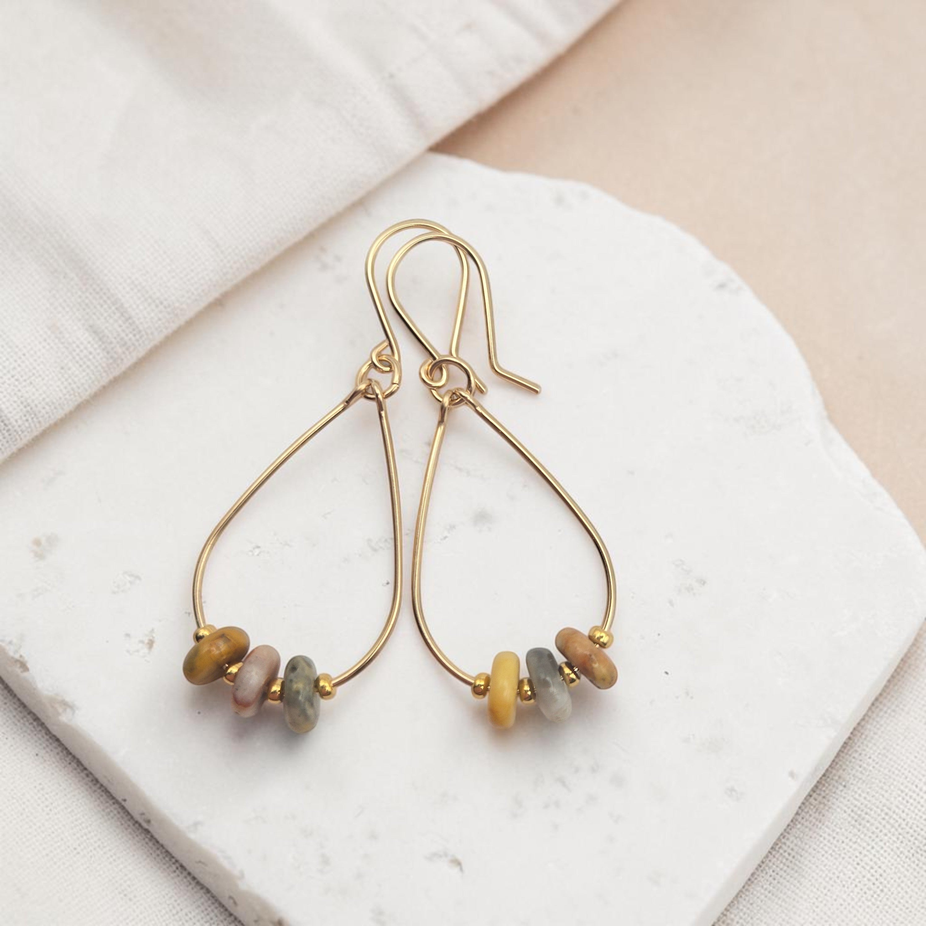 Bijou by SAM Stardust teardrop hoop earrings featuring crazy lace agate stones in 14k gold fill on a stone base.