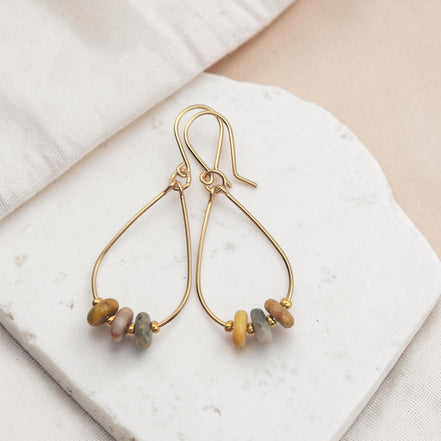 Bijou by SAM Stardust teardrop hoop earrings featuring crazy lace agate stones in 14k gold fill on a stone base.