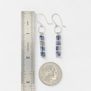 Bijou by SAM Stone Creek earrings featuring blue spot jasper tube beads and sterling silver hoops on a white background