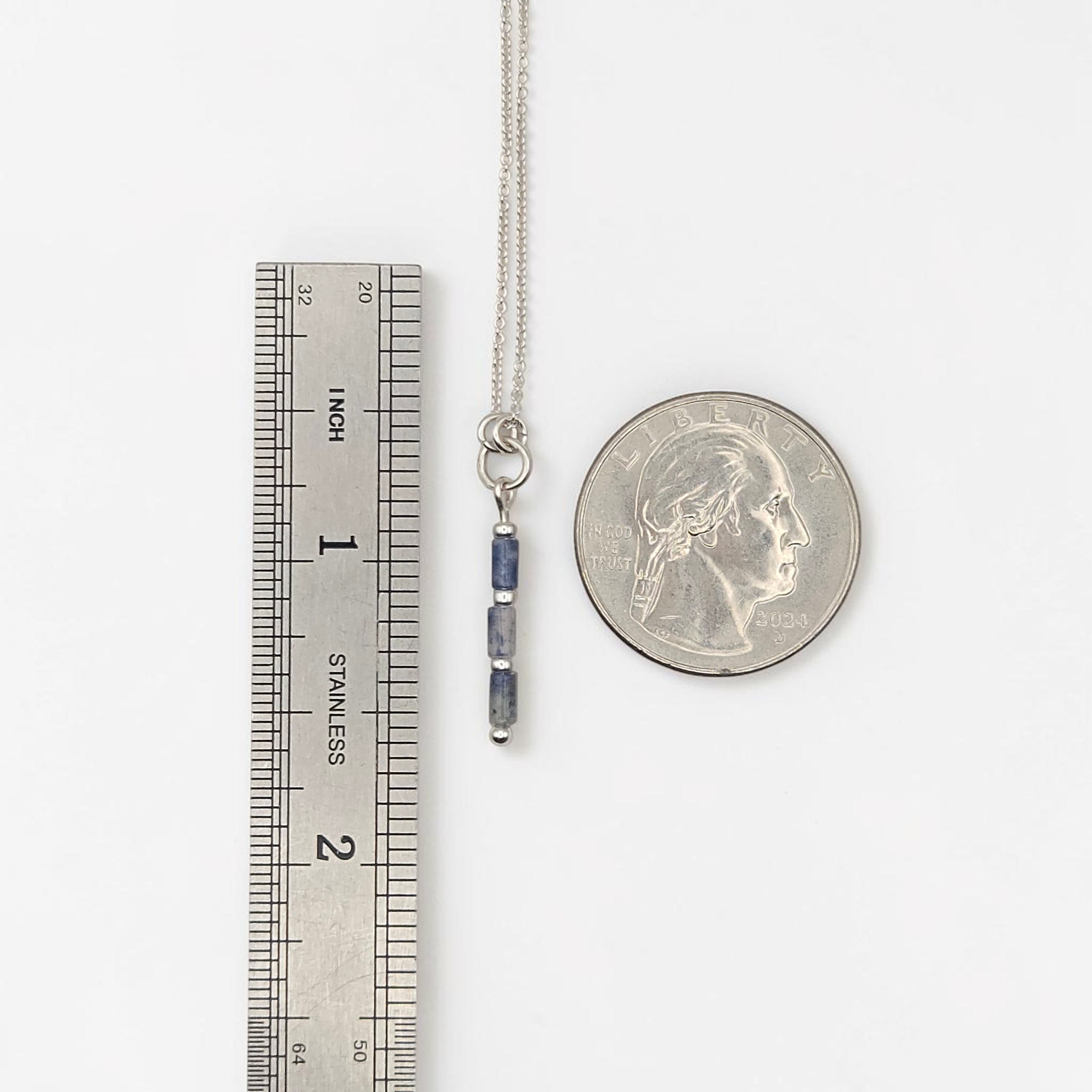 Bijou by SAM Stone Creek necklace with blue spot jasper tube beads and sterling silver chain next to a ruler and coin