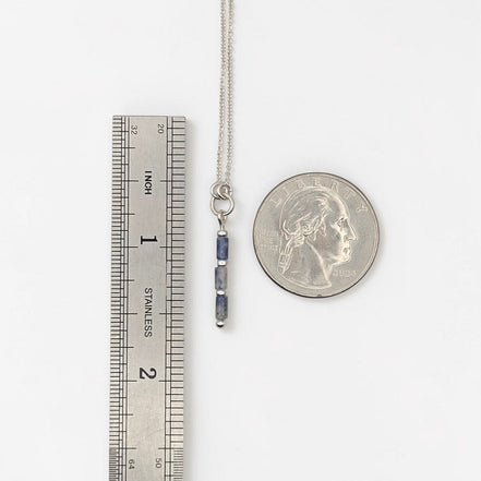 Bijou by SAM Stone Creek necklace with blue spot jasper tube beads and sterling silver chain next to a ruler and coin